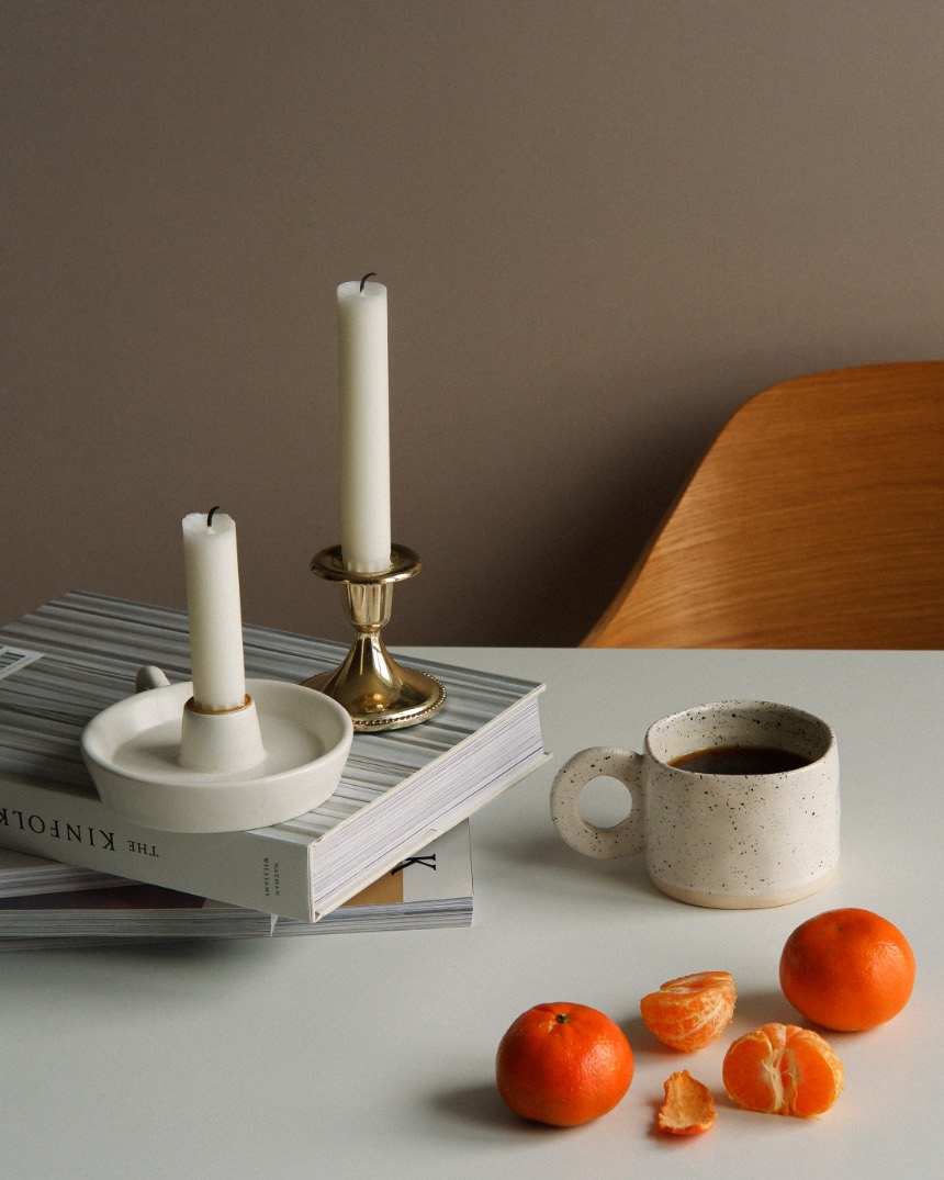 Table set with linen and glassware in a warm dining room
